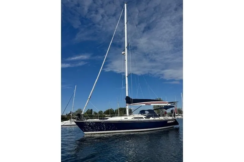 The Image of 1988 C&C 44 sailboat on calm water under a clear blue sky. - 0