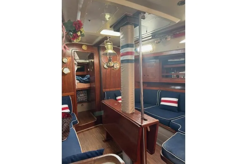 Slide: The Image of Interior of 1988 C&C 44 sailboat with wood finish and nautical decor. - 5