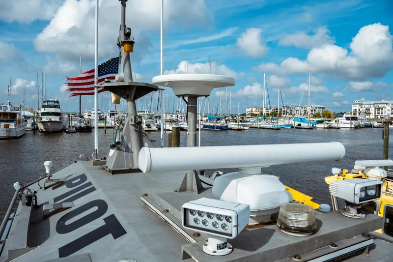 Slide: The Image of 2004 Kvichak Marine Industries Pilot boat docked at marina with American flag. - 13