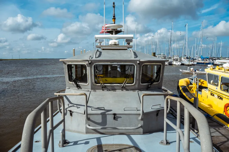 Slide: The Image of 2004 Kvichak Marine Industries Pilot boat docked at marina with sailboats in background. - 17