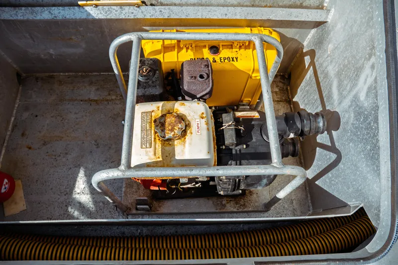 Slide: The Image of Engine compartment of a 2004 Kvichak Marine Industries Pilot boat, featuring a yellow and white engine. - 19