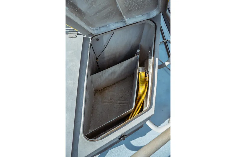 Slide: The Image of Open compartment on 2004 Kvichak Marine Industries Pilot boat with yellow hose inside. - 20