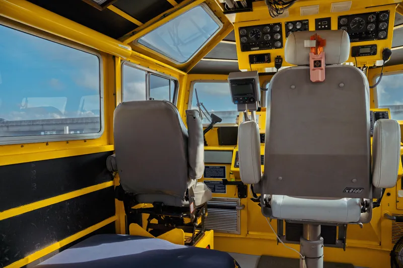 Slide: The Image of Interior of a 2004 Kvichak Marine Industries Pilot boat, featuring control panels and seating. - 27