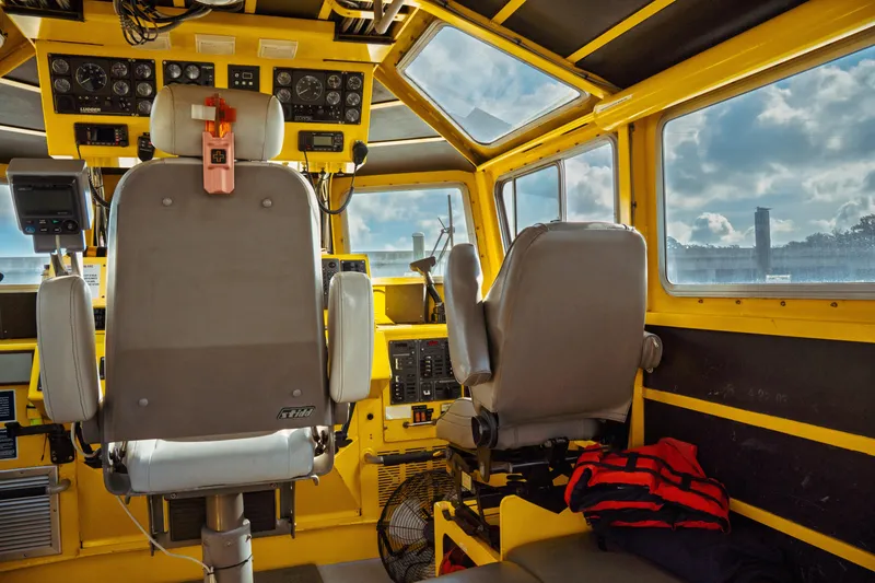 Slide: The Image of Interior of a 2004 Kvichak Marine Industries Pilot boat cockpit with control panels. - 28