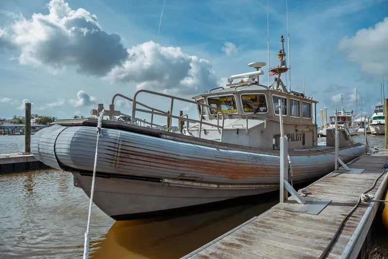 Slide: The Image of 2004 Kvichak Marine Industries Pilot boat docked under a cloudy sky. - 3
