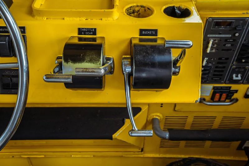 Slide: The Image of Close-up of 2004 Kvichak Marine Industries Pilot boat controls, featuring throttle and gear levers. - 34