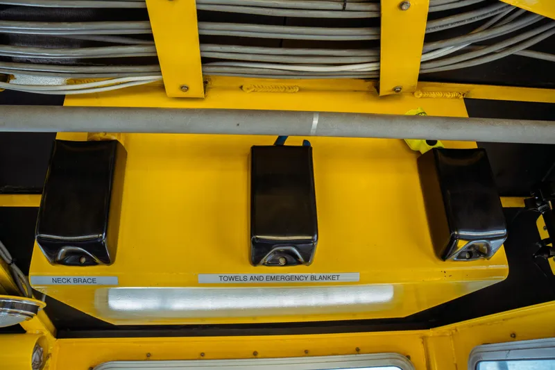 Slide: The Image of Yellow interior of a 2004 Kvichak Marine Industries Pilot boat with emergency supplies. - 40
