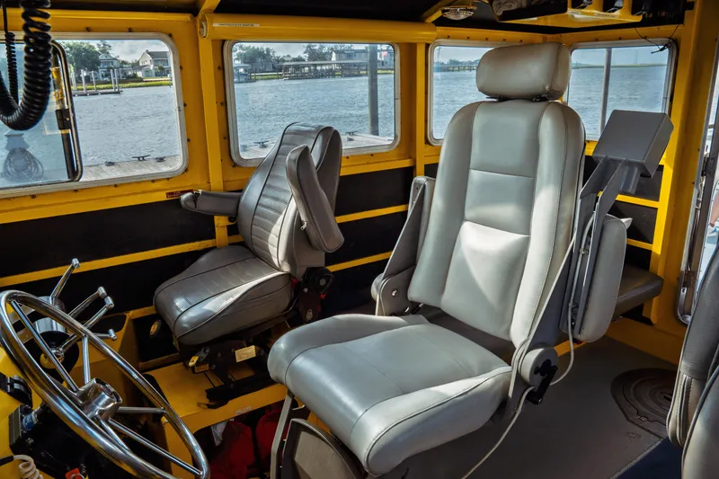 Slide: The Image of Interior of a 2004 Kvichak Marine Industries Pilot boat with steering wheel and seats. - 41