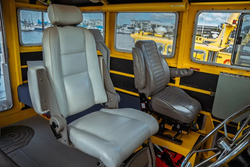 Slide: The Image of Interior of a 2004 Kvichak Marine Industries Pilot boat, featuring two captain's chairs. - 42