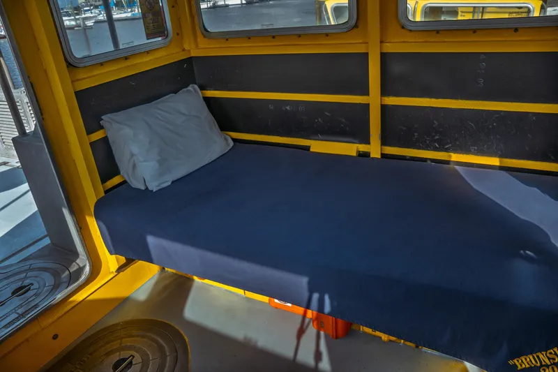 Slide: The Image of Interior of a 2004 Kvichak Marine Industries Pilot boat with a simple bed setup. - 46