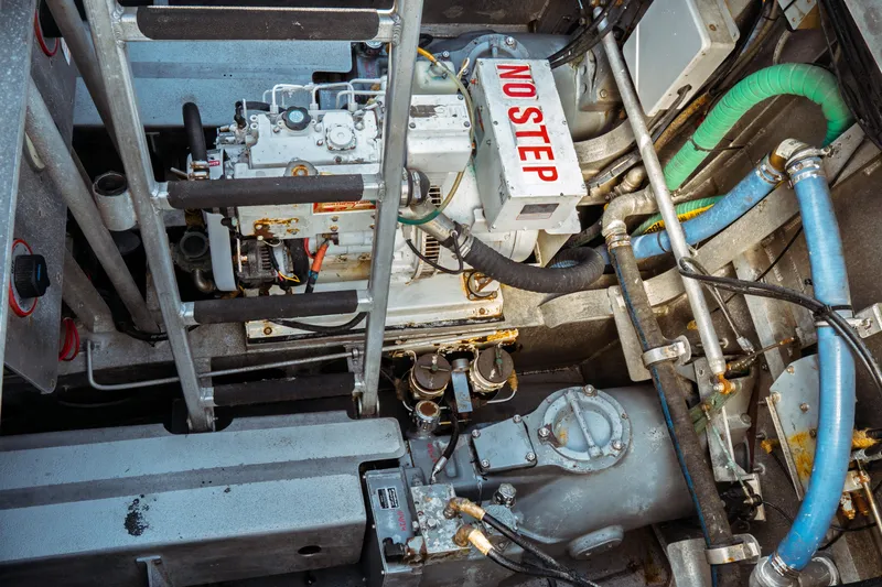 Slide: The Image of Engine room of 2004 Kvichak Marine Industries Pilot boat with visible machinery and "No Step" sign. - 48