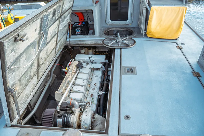 Slide: The Image of 2004 Kvichak Marine Industries Pilot boat engine compartment with open hatch, revealing engine details. - 52
