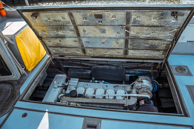 Slide: The Image of Engine compartment of a 2004 Kvichak Marine Industries Pilot boat, showcasing mechanical components. - 56