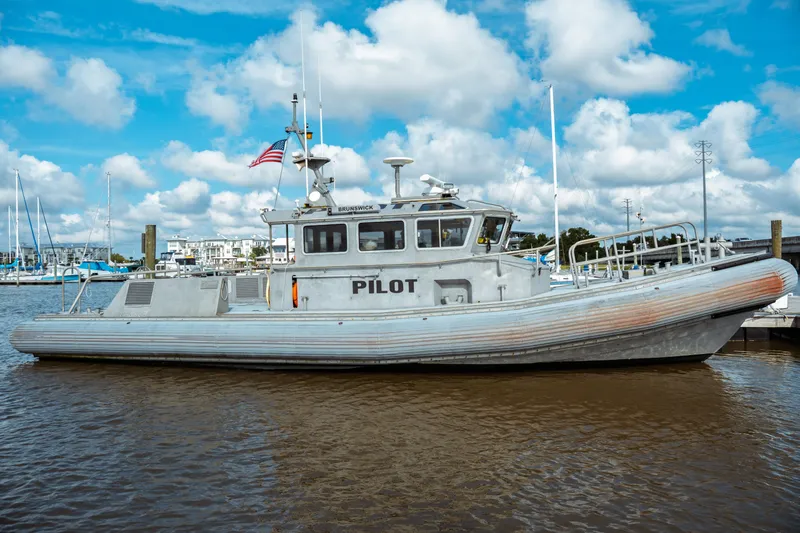 Slide: The Image of 2004 Kvichak Marine Industries Pilot boat docked in marina under blue sky. - 6