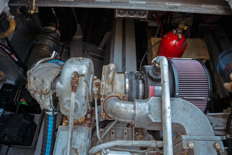 Slide: The Image of Engine compartment of a 2004 Kvichak Marine Industries Pilot boat, featuring mechanical components. - 60