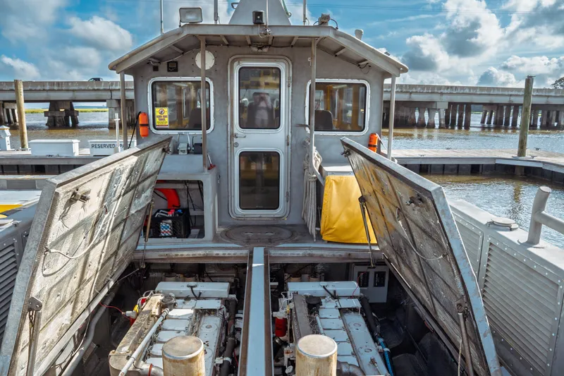 Slide: The Image of 2004 Kvichak Marine Industries Pilot boat with open engine compartments at dock. - 61