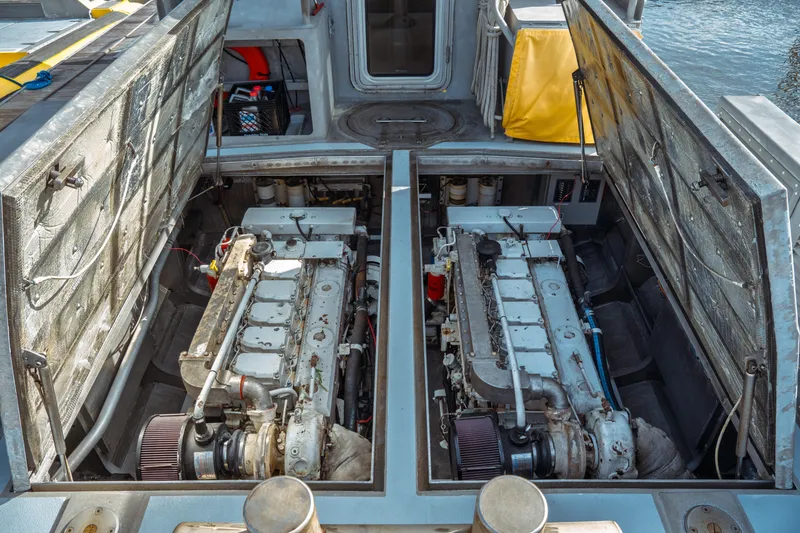 Slide: The Image of Engine compartment of a 2004 Kvichak Marine Industries Pilot boat, showcasing dual engines. - 62
