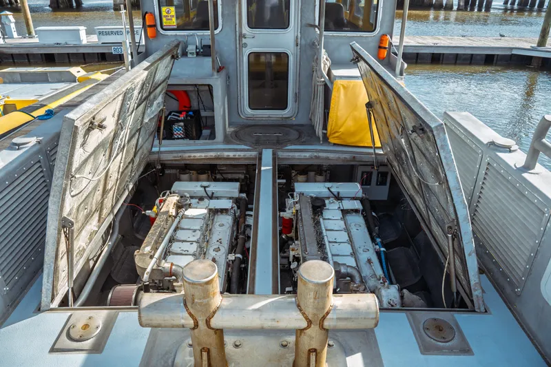 Slide: The Image of 2004 Kvichak Marine Industries Pilot boat engine compartment with open hatches at dock. - 63