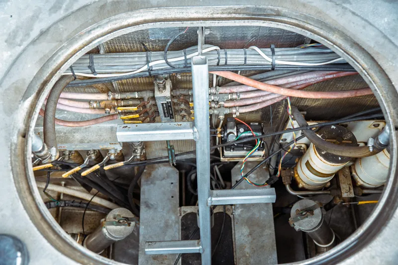 Slide: The Image of Engine compartment of a 2004 Kvichak Marine Industries Pilot boat, showing wiring and mechanical components. - 67