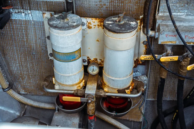 Slide: The Image of Engine compartment of a 2004 Kvichak Marine Industries Pilot boat, showing fuel filters and pipes. - 68