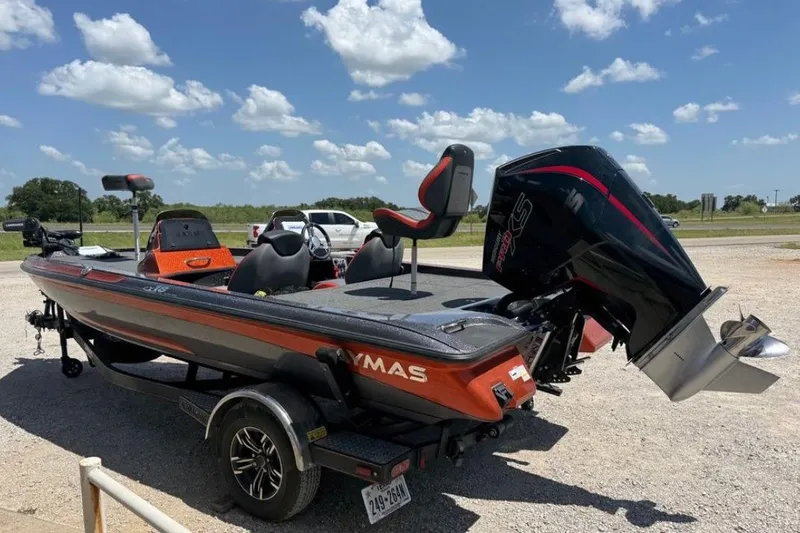 Slide: The Image of 2025 Caymas CX 18 Pro boat with powerful outboard motor, parked outdoors under blue sky. - 4
