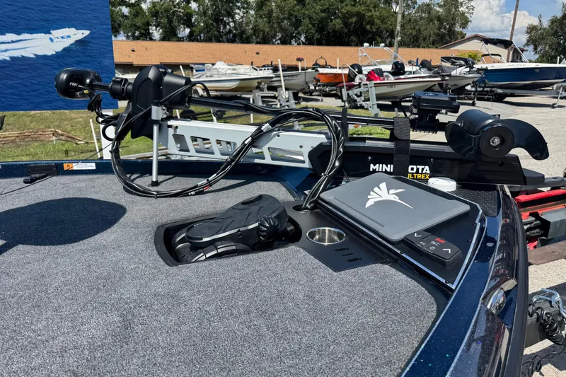 Slide: The Image of 2026 Ranger Z520 boat deck with Minn Kota Ultrex trolling motor and control panel. - 10