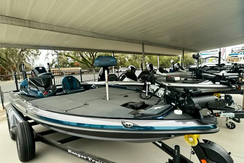 Slide: The Image of 2026 Ranger Z520 boat displayed in a covered area, showcasing sleek design and modern features. - 15
