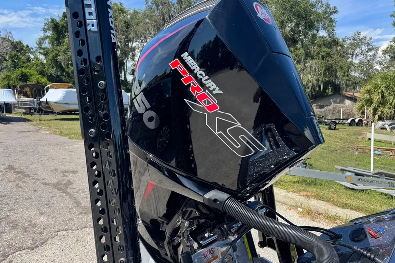 Slide: The Image of 2026 Ranger Z520 with Mercury Pro XS engine, parked outdoors on a sunny day. - 5