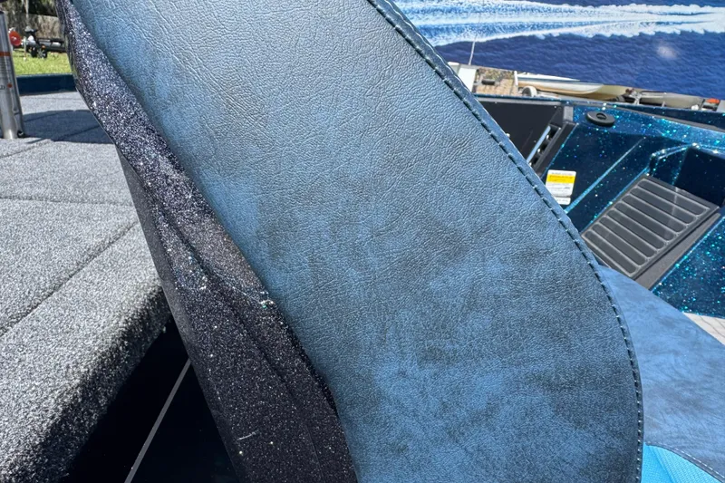 Slide: The Image of Blue leather seat detail on 2026 Ranger Z520 boat, with glitter accents and textured flooring. - 7