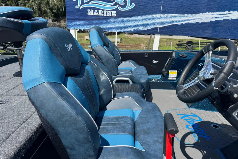 Slide: The Image of 2026 Ranger Z520 boat interior with blue seats and steering wheel. - 8