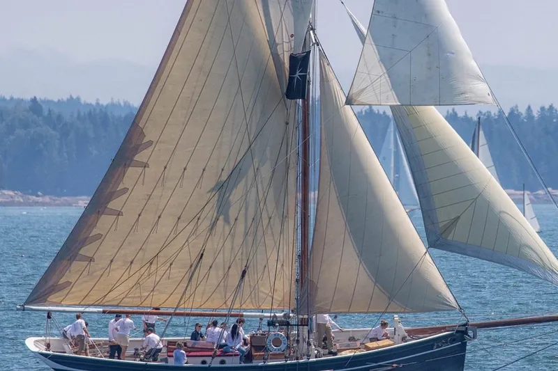 Slide: The Image of Sailing on a 2004 Custom Luke Powell Pilot Cutter with full sails on a clear day. - 1