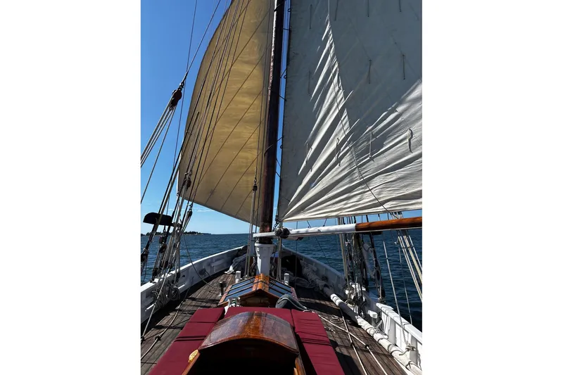 Slide: The Image of Sailing on a 2004 Custom Luke Powell Pilot Cutter with full sails on open water. - 15
