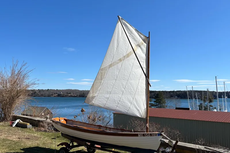 Slide: The Image of Custom 2004 Luke Powell Pilot Cutter sailboat on trailer by scenic waterfront. - 36