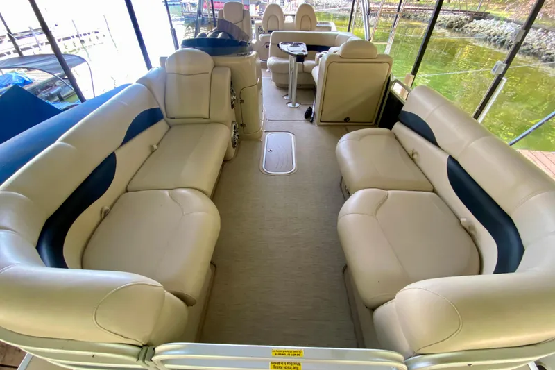 Slide: The Image of 2014 AquaPatio 220 WB boat interior with spacious seating and elegant design. - 5