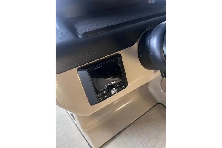 Slide: The Image of 2024 Harris Sunliner 230 dashboard featuring JL Audio system. - 13