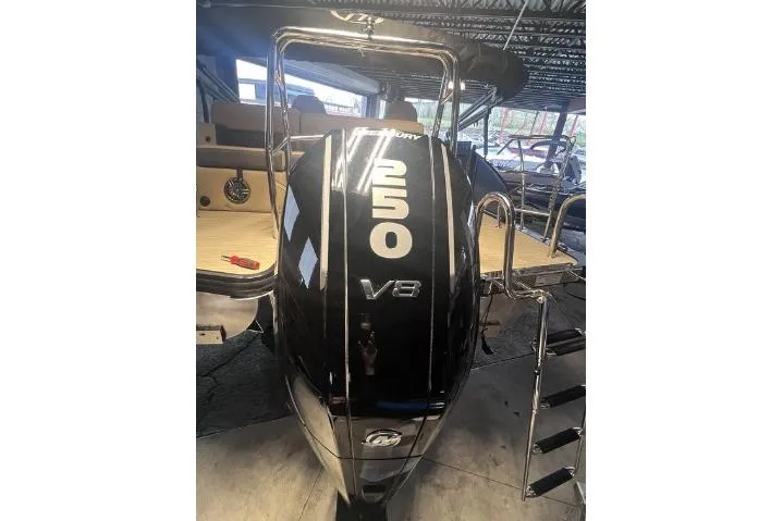 Slide: The Image of 2024 Harris Sunliner 230 with powerful Mercury 250 V8 engine in a showroom. - 22