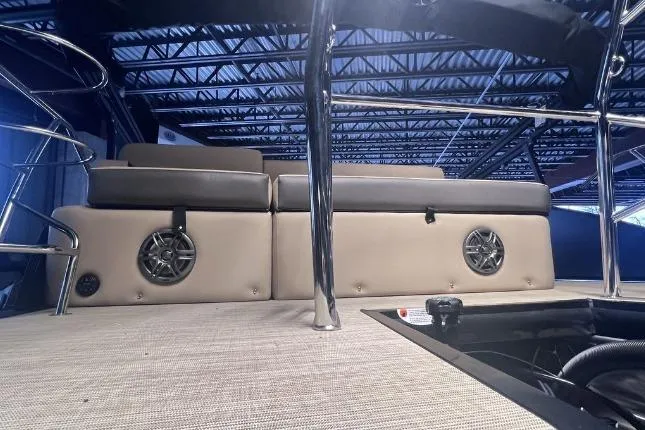 Slide: The Image of 2024 Harris Sunliner 230 interior with cushioned seating and built-in speakers. - 24