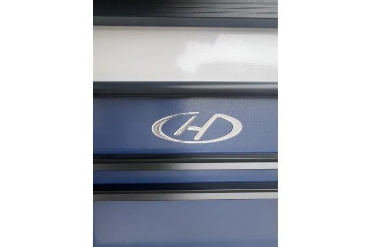 Slide: The Image of 2024 Harris Sunliner 230 logo on blue and white panel. - 4
