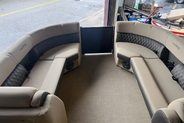 Slide: The Image of 2024 Harris Sunliner 230 interior with luxurious seating and modern design. - 7