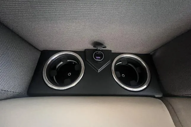 Slide: The Image of 2024 Harris Sunliner 230 interior cup holders with USB charging port. - 9