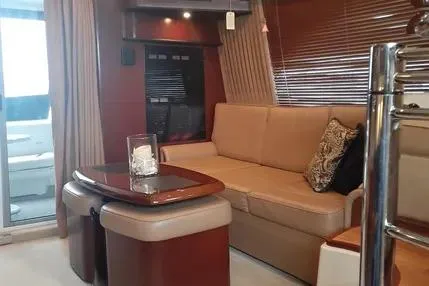 Slide: The Image of Luxurious interior of 2005 Sea Ray 420 Sedan Bridge yacht with elegant seating and decor. - 10