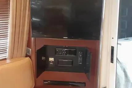 Slide: The Image of 2005 Sea Ray 420 Sedan Bridge interior with TV and entertainment system. - 12