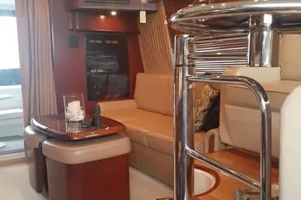 Slide: The Image of Luxurious interior of a 2005 Sea Ray 420 Sedan Bridge yacht with elegant seating. - 14