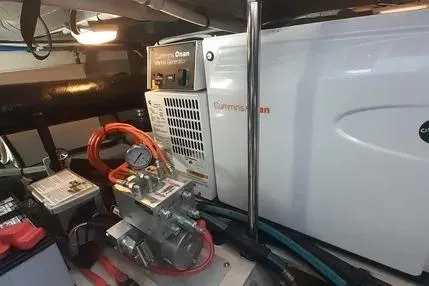 Slide: The Image of 2005 Sea Ray 420 Sedan Bridge engine room with Cummins Onan generator. - 23