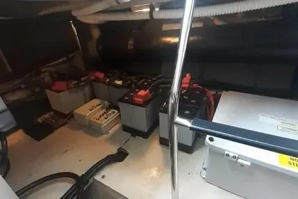 Slide: The Image of 2005 Sea Ray 420 Sedan Bridge engine room with batteries and wiring. - 25