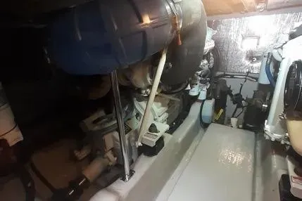 Slide: The Image of Engine room of 2005 Sea Ray 420 Sedan Bridge, showcasing mechanical components. - 27