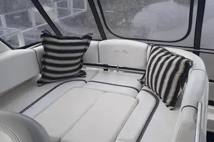 Slide: The Image of 2005 Sea Ray 420 Sedan Bridge interior with striped cushions and sleek white seating. - 6