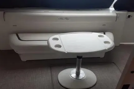 Slide: The Image of 2005 Sea Ray 420 Sedan Bridge interior with table and seating area. - 9