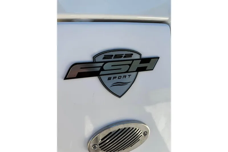 Slide: The Image of 2023 Yamaha 252 FSH Sport logo on white surface, showcasing sleek design. - 12