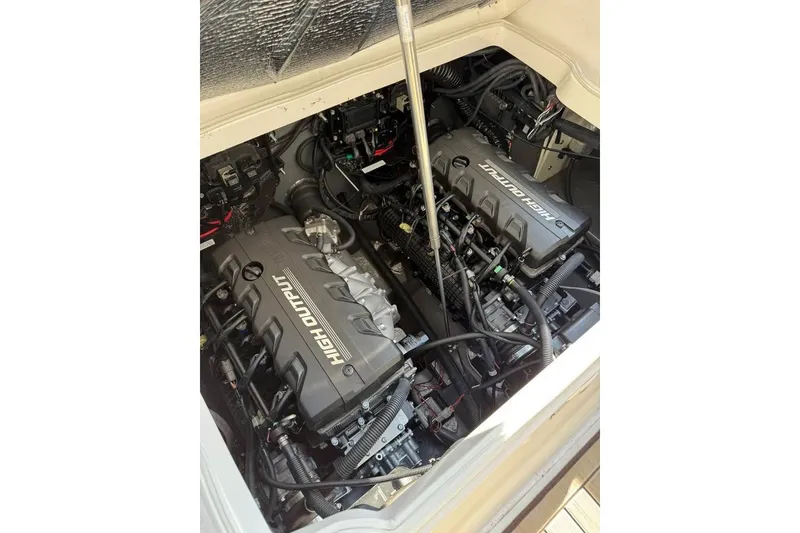 Slide: The Image of 2023 Yamaha 252 FSH boat engine compartment with high output engines. - 4